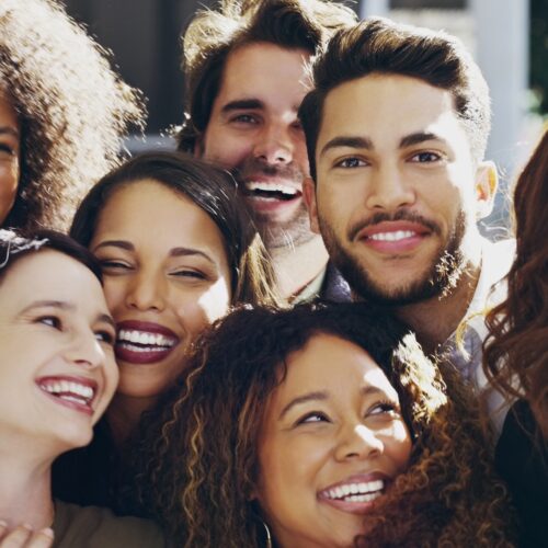 Cropped shot of a group of happy businesspeople standing in their workplace lobby
